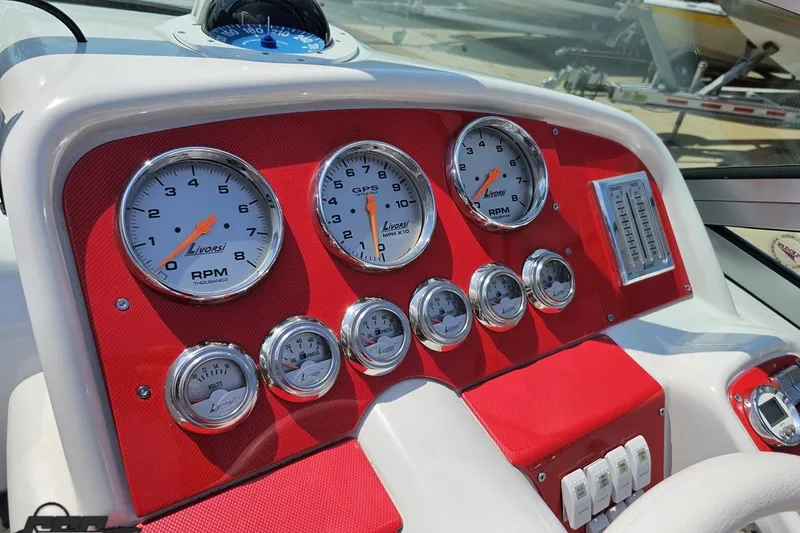 Slide: The Image of Dashboard of a 2005 Formula 353 FASTech boat with Livorsi gauges and red accents. - 63