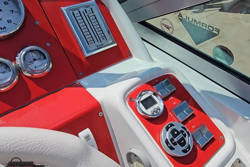 Slide: The Image of Dashboard of a 2005 Formula 353 FASTech boat with gauges and controls. - 65