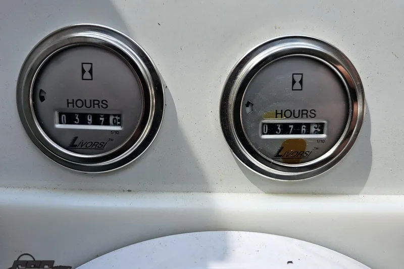 Slide: The Image of 2005 Formula 353 FASTech hour meters displaying 397.0 and 376.2 hours. - 69