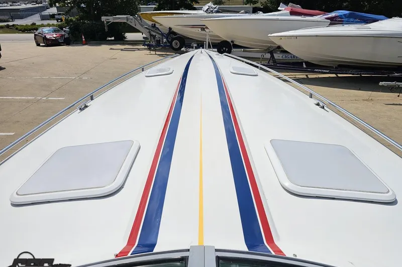 Slide: The Image of 2005 Formula 353 FASTech boat with red, blue, and yellow stripes on deck. - 71