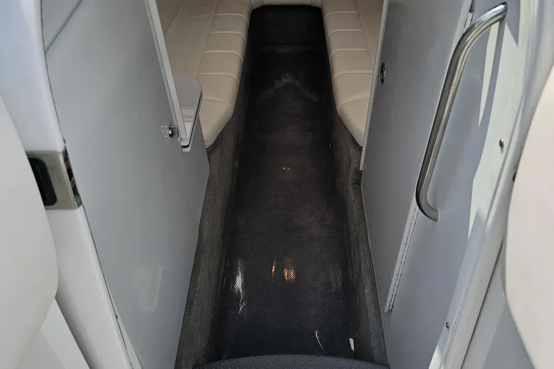 Slide: The Image of 2005 Formula 353 FASTech cabin interior with white seating and carpeted floor. - 72