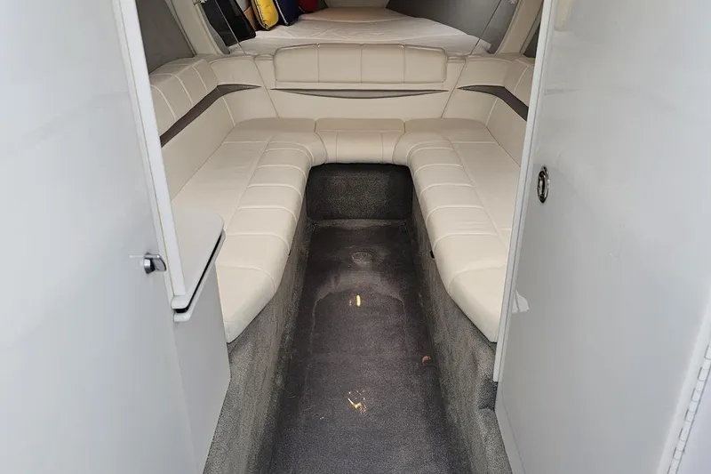 Slide: The Image of Interior of 2005 Formula 353 FASTech boat with white seating and carpeted floor. - 73