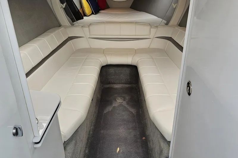 Slide: The Image of 2005 Formula 353 FASTech cabin interior with white leather seating and carpeted floor. - 74