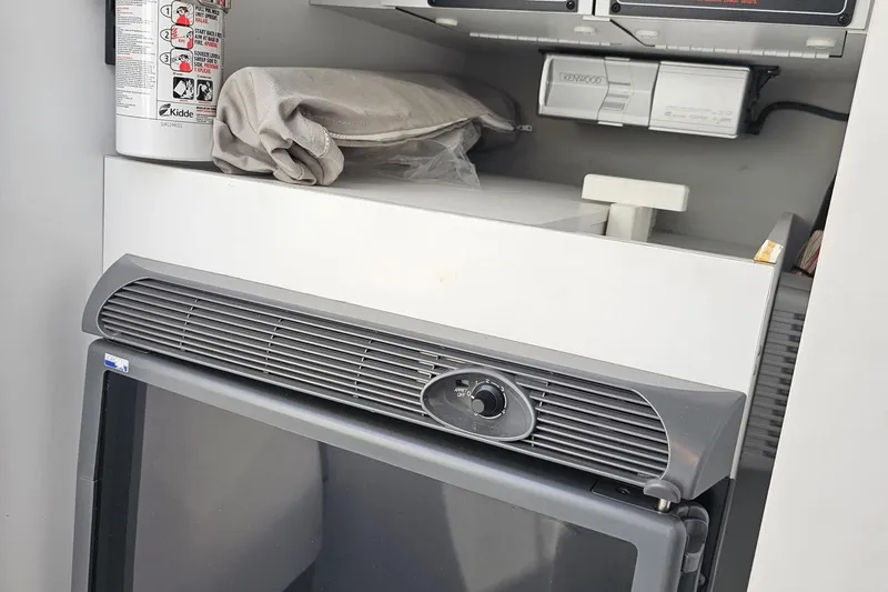 Slide: The Image of 2005 Formula 353 FASTech interior with fire extinguisher and Kenwood equipment. - 77