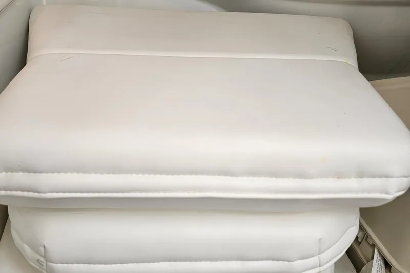 Slide: The Image of White cushioned seat on 2005 Formula 353 FASTech boat interior. - 84