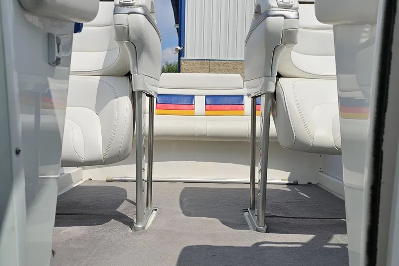 Slide: The Image of Interior of a 2005 Formula 353 FASTech boat with white seating and colorful accents. - 85