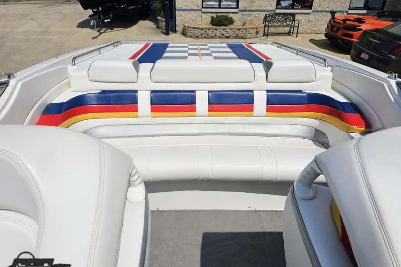 Slide: The Image of 2005 Formula 353 FASTech boat interior with colorful striped seating. - 86