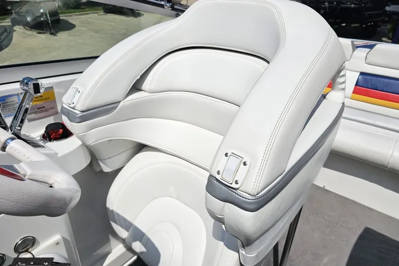 Slide: The Image of 2005 Formula 353 FASTech boat interior with white leather seating and control panel. - 87