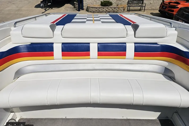 Slide: The Image of 2005 Formula 353 FASTech boat interior with colorful striped seating. - 89