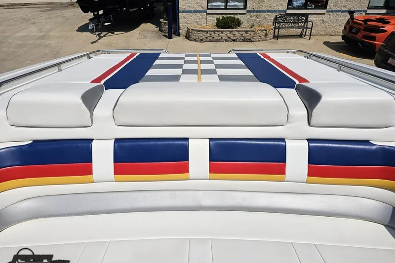 Slide: The Image of 2005 Formula 353 FASTech boat with colorful striped upholstery design. - 90