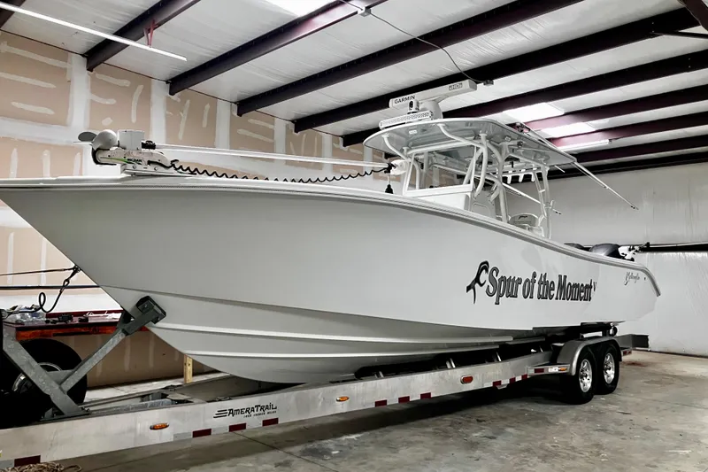 Slide: The Image of 2020 Yellowfin 32 Offshore boat on trailer in indoor storage. - 11