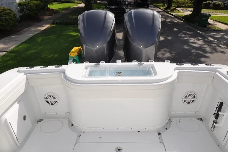 Slide: The Image of 2020 Yellowfin 32 Offshore boat deck with dual engines and livewell. - 15