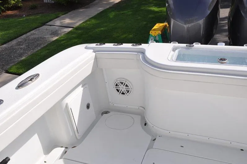 Slide: The Image of 2020 Yellowfin 32 Offshore boat interior with speaker and storage compartments. - 17