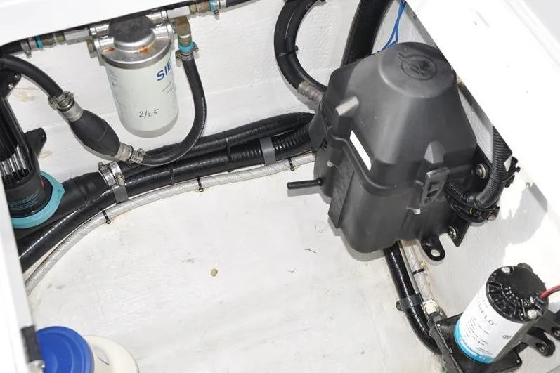 Slide: The Image of Engine compartment of 2020 Yellowfin 32 Offshore boat, showing fuel filter and wiring. - 19