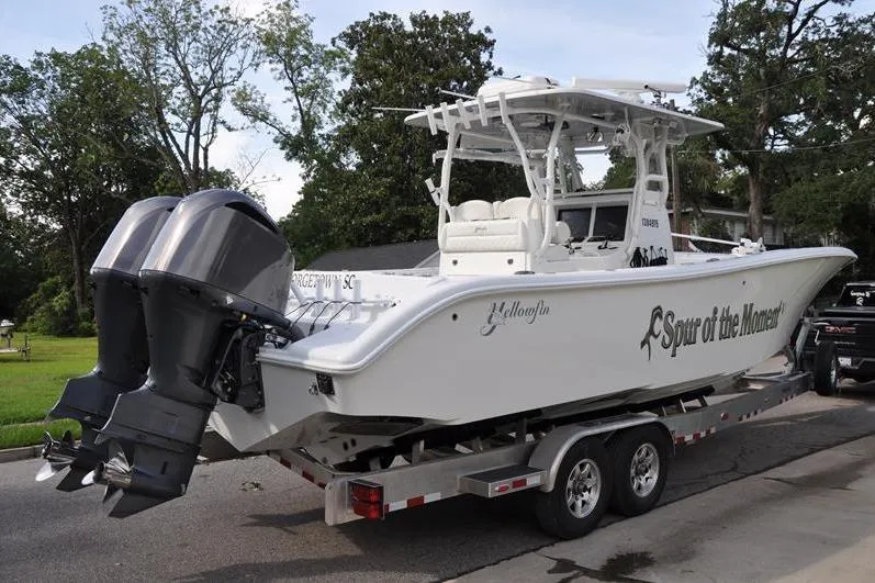 Slide: The Image of 2020 Yellowfin 32 Offshore boat on trailer with dual outboard motors. - 2