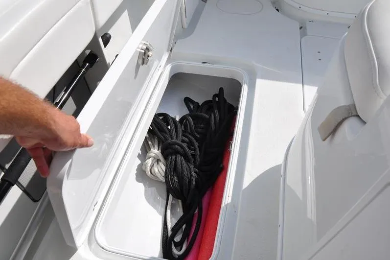 Slide: The Image of Storage compartment on a 2020 Yellowfin 32 Offshore boat with ropes inside. - 22