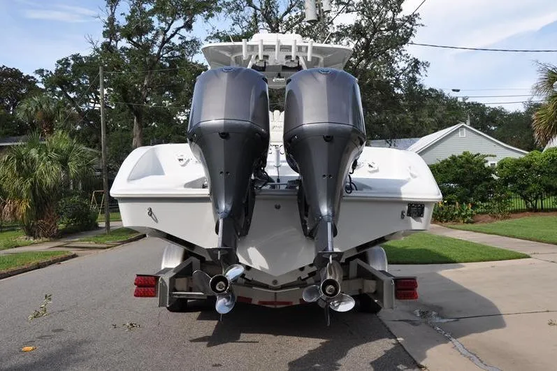 Slide: The Image of 2020 Yellowfin 32 Offshore boat with dual outboard engines on a trailer. - 3