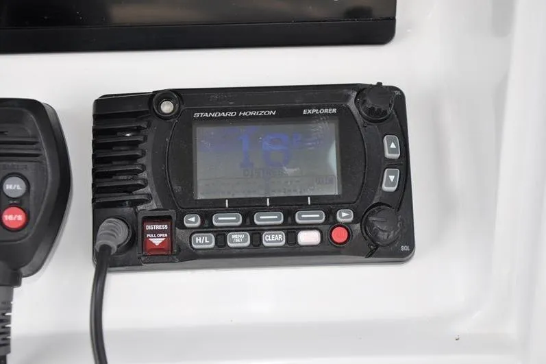 Slide: The Image of Standard Horizon Explorer radio on 2020 Yellowfin 32 Offshore boat dashboard. - 31