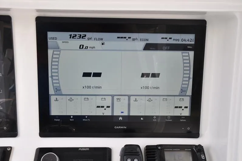 Slide: The Image of Garmin display on 2020 Yellowfin 32 Offshore boat showing speed and fuel data. - 34