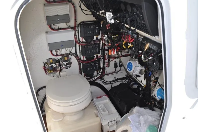 Slide: The Image of 2020 Yellowfin 32 Offshore boat interior with toilet and electrical wiring. - 38