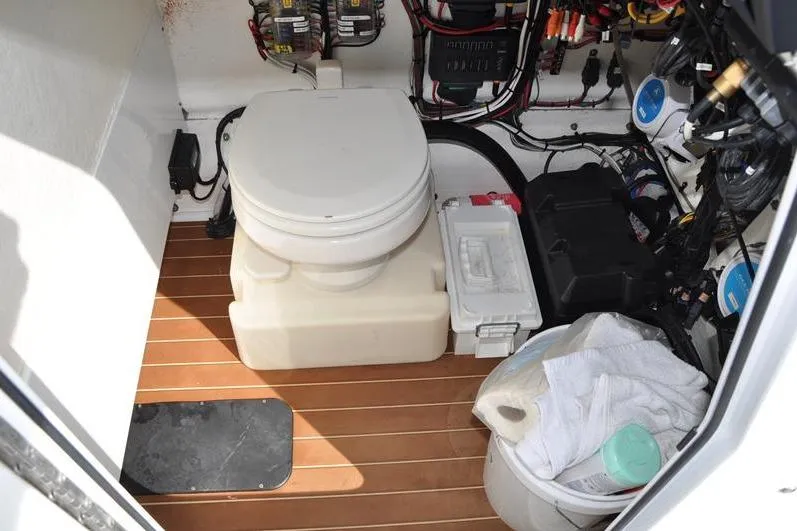 Slide: The Image of Interior of 2020 Yellowfin 32 Offshore boat with toilet and storage area. - 39