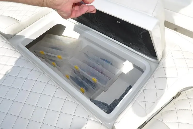 Slide: The Image of Storage compartment on 2020 Yellowfin 32 Offshore boat with organized tackle boxes. - 46