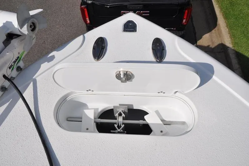 Slide: The Image of 2020 Yellowfin 32 Offshore boat anchor compartment with open hatch, showing anchor storage. - 47