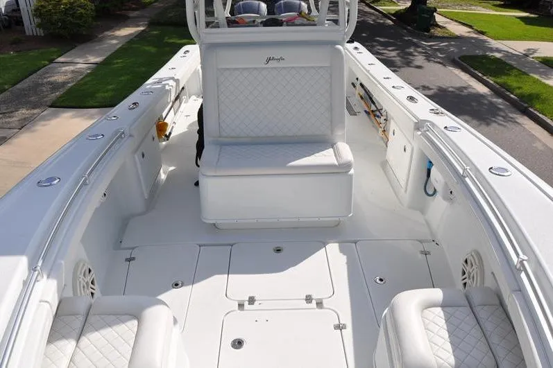 Slide: The Image of 2020 Yellowfin 32 Offshore boat interior with white seating and deck. - 50
