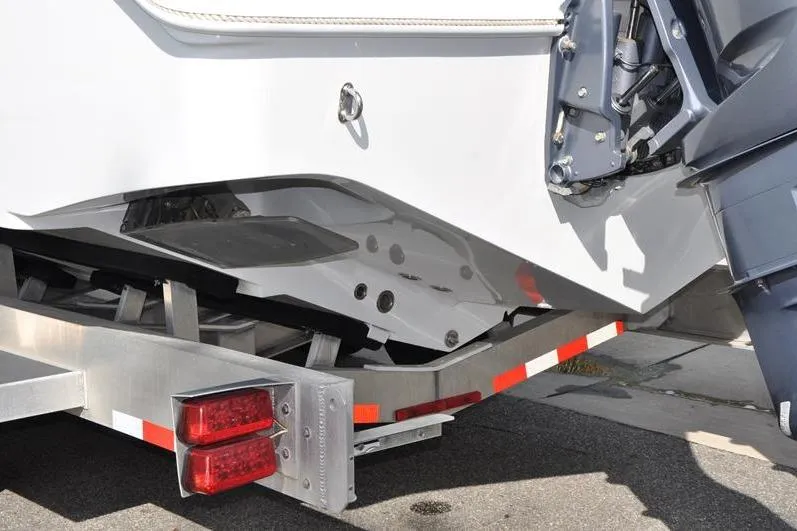 Slide: The Image of 2020 Yellowfin 32 Offshore boat on trailer, rear view with outboard motor. - 9