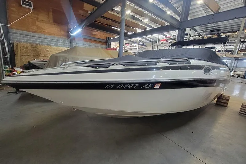 The Image of 2001 Crownline 230 BR boat in indoor storage facility. - 1