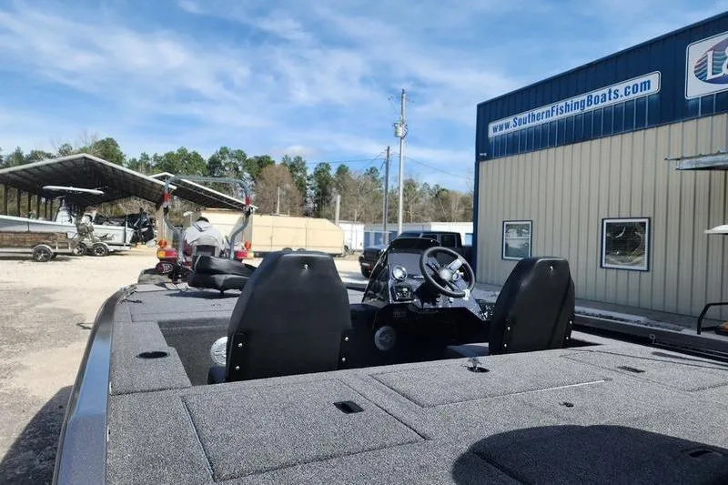 Slide: The Image of 2023 Lowe Stinger 178 boat at Southern Fishing Boats dealership, sunny day. - 10