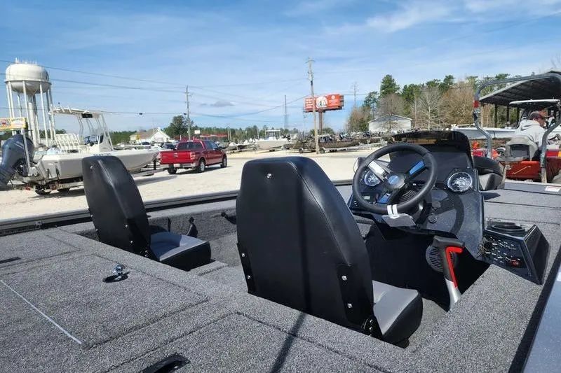 Slide: The Image of 2023 Lowe Stinger 178 boat interior with dual seats and steering console. - 5