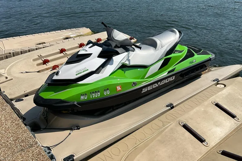 The Image of 2014 Sea-Doo GTI SE 130 jet ski on dock by the water. - 0