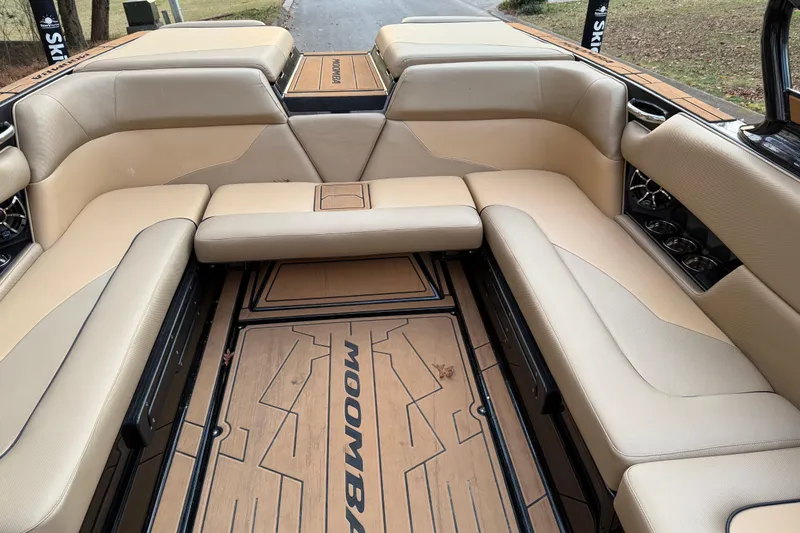 Slide: The Image of 2022 Moomba Mojo boat interior with beige seating and stylish flooring. - 21