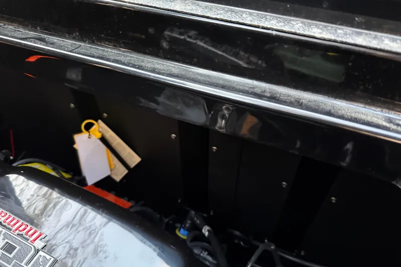 Slide: The Image of 2022 Moomba Mojo engine compartment with visible components and tags. - 9