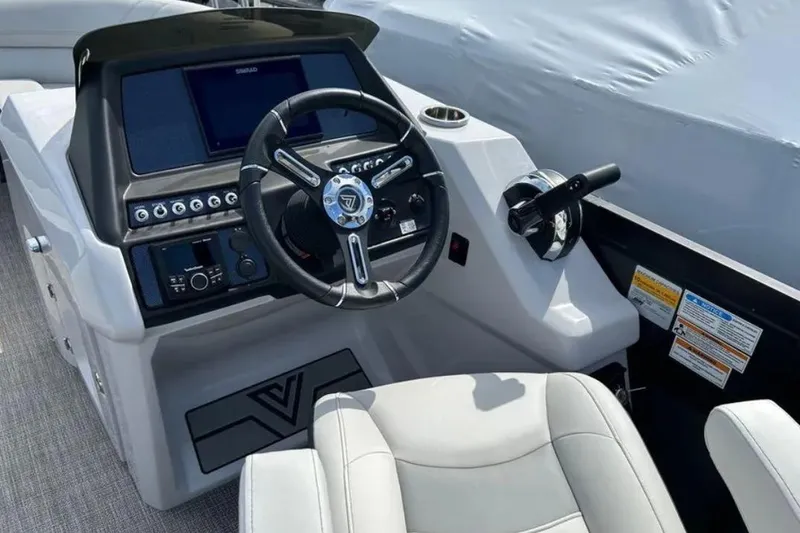 Slide: The Image of 2023 Viaggio D23U boat dashboard with steering wheel and control panel. - 13