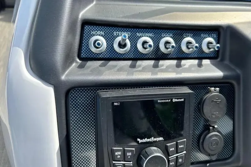 Slide: The Image of Control panel of 2023 Viaggio D23U with switches and audio system. - 14