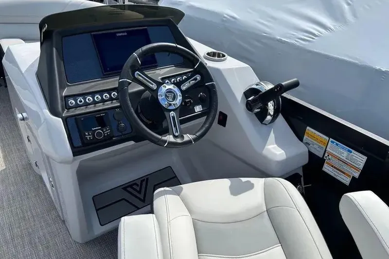 Slide: The Image of 2023 Viaggio D23U boat cockpit with steering wheel, control panel, and comfortable seating. - 15