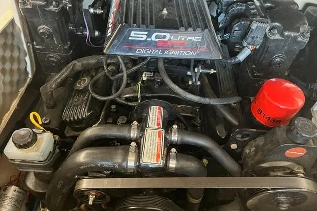 Slide: The Image of Engine of a 1999 Sea Ray 210 Sundeck with 5.0L digital ignition system. - 5