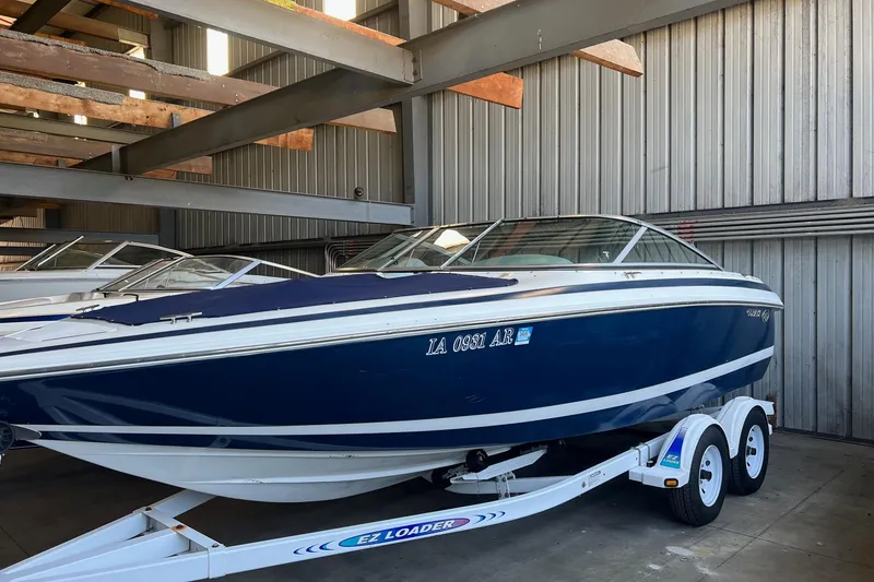 The Image of 1999 Cobalt 206 boat on trailer in storage facility. - 1