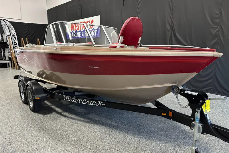 Slide: The Image of 1998 Lund 1800 Fisherman ITS boat on ShoreLand'r trailer in showroom. - 0