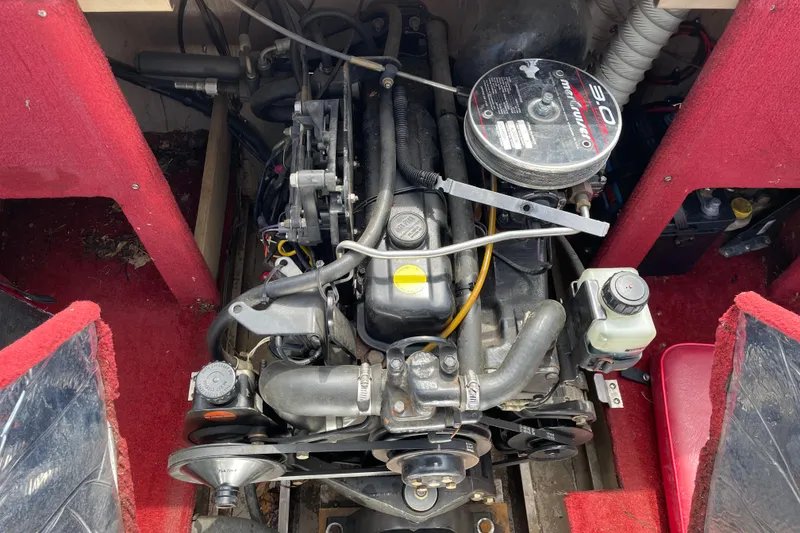 Slide: The Image of 1998 Lund 1800 Fisherman ITS boat with red interior and windshield in showroom. - 12