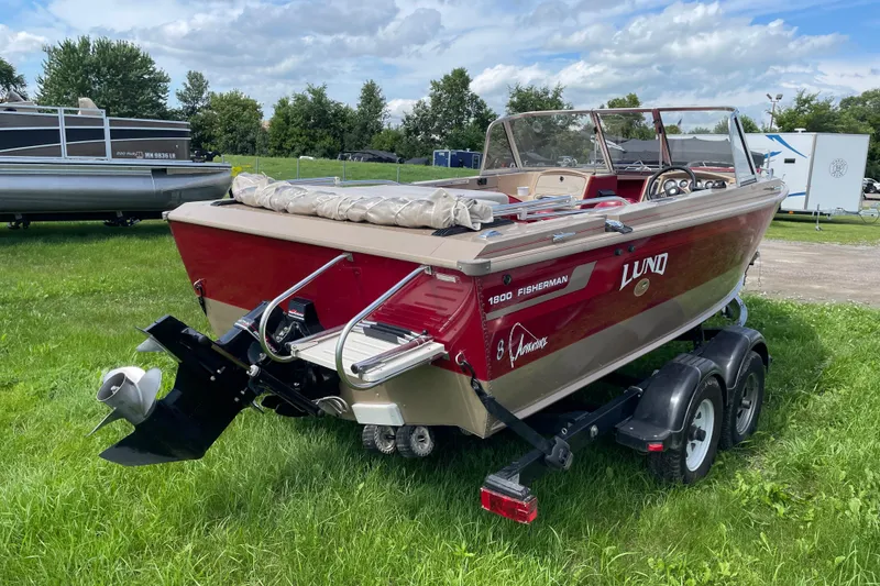 Slide: The Image of 1998 Lund 1800 Fisherman ITS boat on trailer in garage setting. - 3