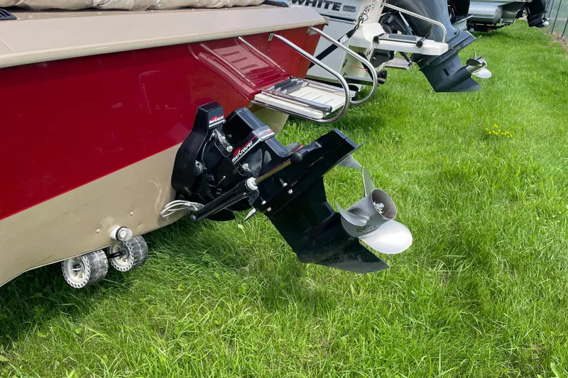 Slide: The Image of 1998 Lund 1800 Fisherman ITS boat with Mercury outboard motor and propeller. - 5