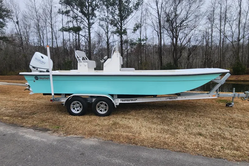 The Image of 2023 May-Craft 22 Hancock Skiff on trailer, parked outdoors near trees. - 0