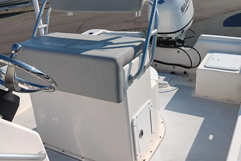 Slide: The Image of 2023 May-Craft 22 Hancock Skiff boat interior with seating and storage compartments. - 10