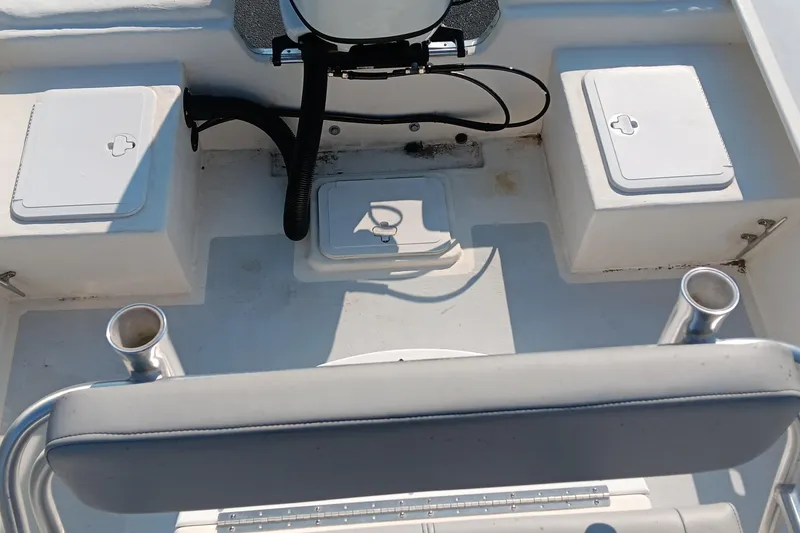 Slide: The Image of 2023 May-Craft 22 Hancock Skiff boat console with steering wheel and controls. - 13