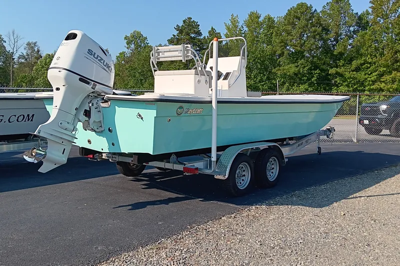 Slide: The Image of 2023 May-Craft 22 Hancock Skiff with Suzuki engine on trailer, parked outdoors. - 3