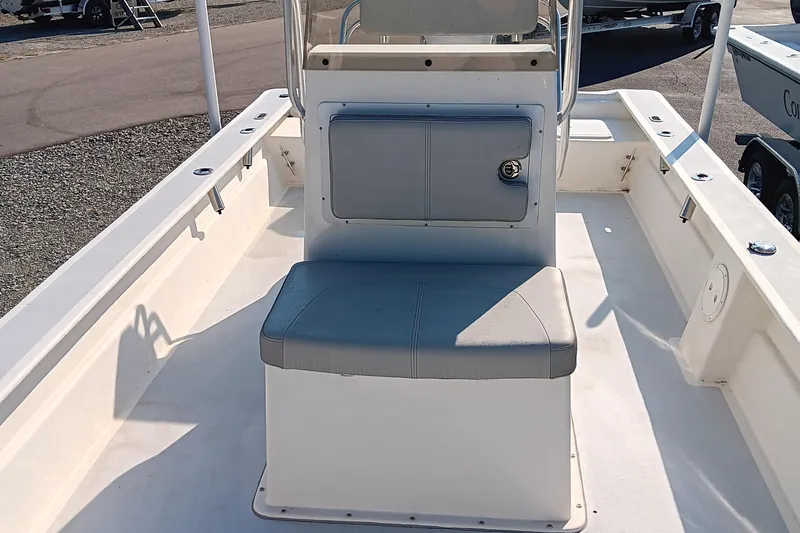 Slide: The Image of 2023 May-Craft 22 Hancock Skiff boat interior near a pond. - 8