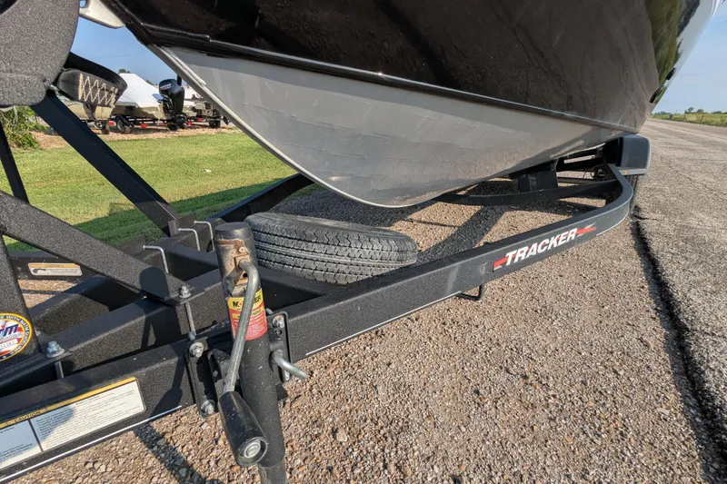 Slide: The Image of 2023 Tracker Targa V-19 Combo Tournament Edition boat on trailer, close-up view. - 12